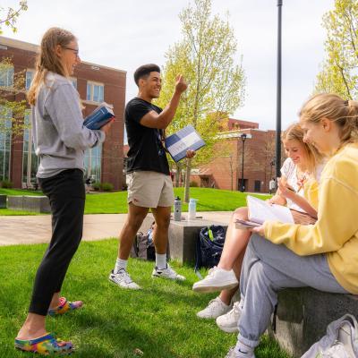 students outdoors for math class, laughing 